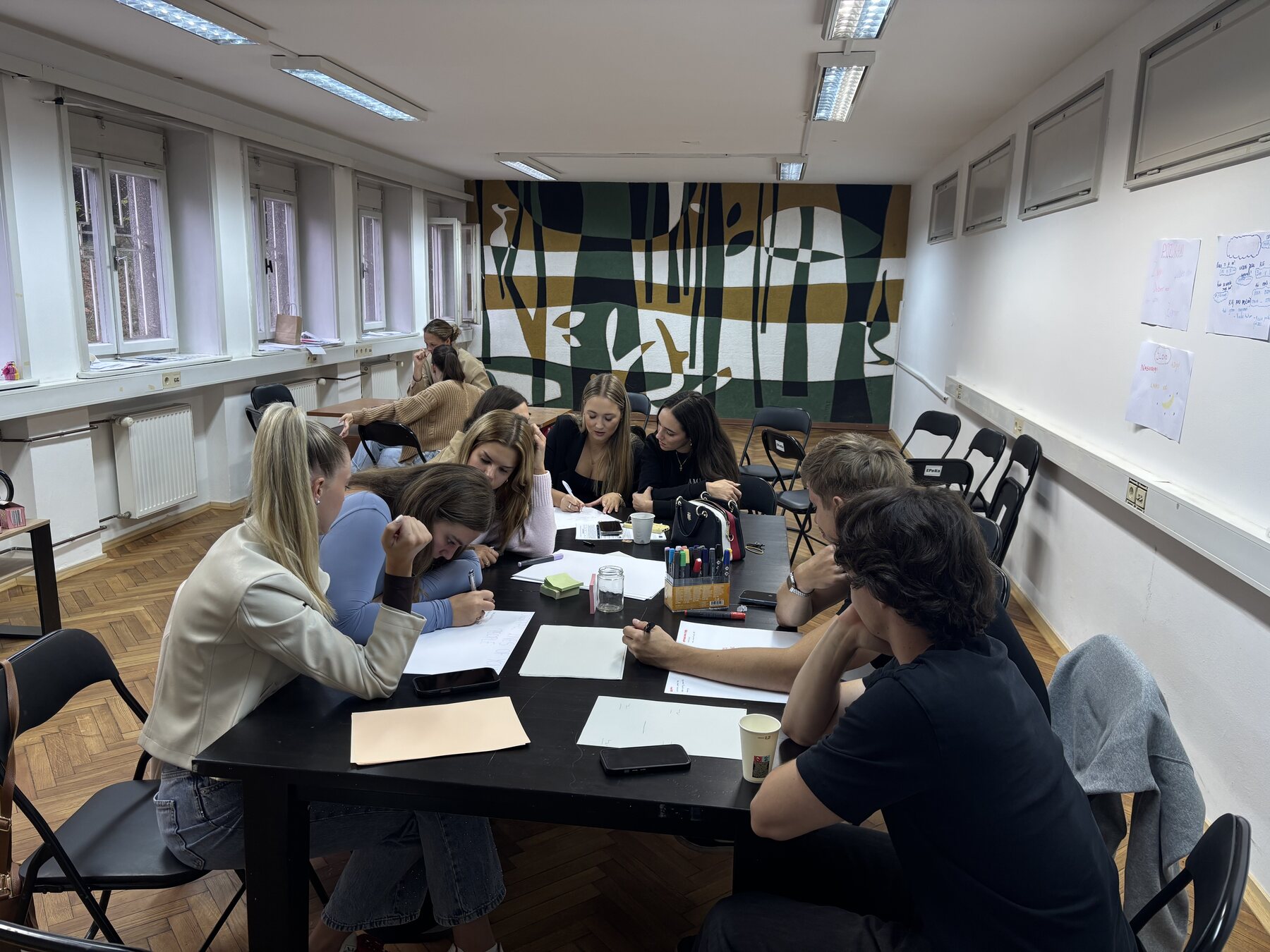 Young people discussing digital citizenship in small groups during a TRUTH4YOUTH workshop in Maribor